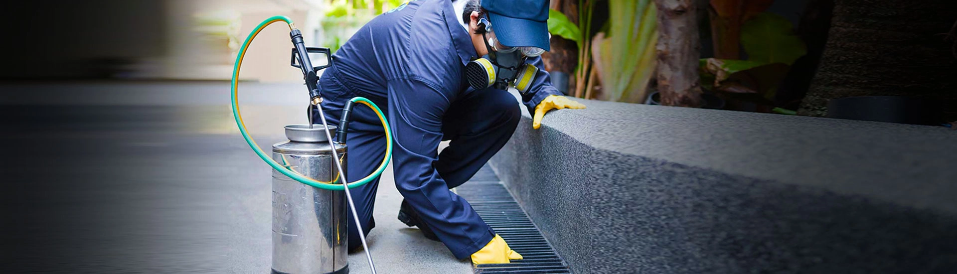 worker checking the drain after using pest control software